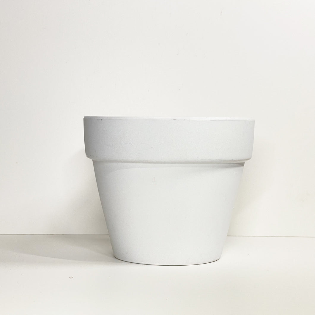 A white terracotta pot with a matte finish. The planter pot includes a drainage hole.